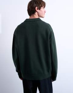 Model wearing Knitted smart polo jumper in dark green