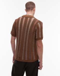 Model wearing Knitted viscose button through polo with metallic stripe in brown