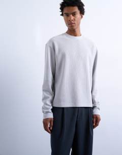 Model wearing Long sleeve crop fit waffle t-shirt in grey