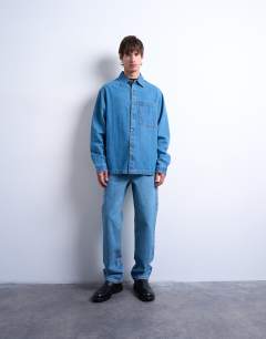 Model wearing Long sleeve denim washed over shirt in blue