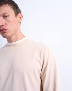 Model wearing Long sleeve doubled layered tee in stone and ecru