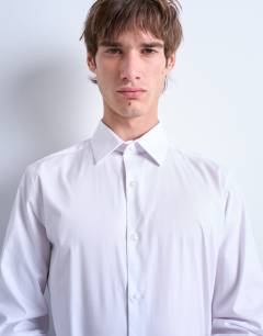 Model wearing Long sleeve formal stretch shirt in white