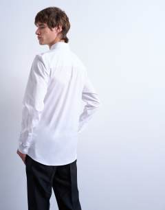 Model wearing Long sleeve formal stretch shirt in white