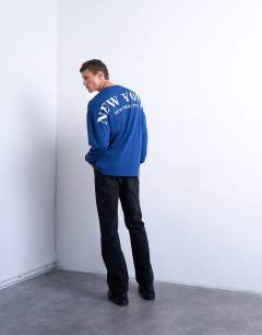 Model wearing Long sleeve oversized New York City print t-shirt in mid blue