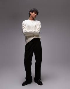 Model wearing Long sleeve relaxed fit waffle t-shirt with henley in ecru