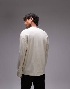 Model wearing Long sleeve relaxed fit waffle t-shirt with henley in ecru