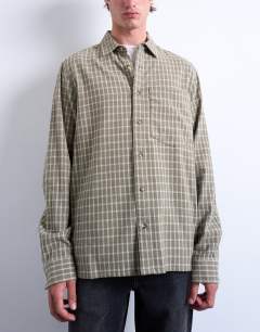Model wearing Long sleeve relaxed grid check shirt in khaki