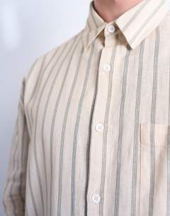 Model wearing Long sleeve relaxed stripe shirt in stone