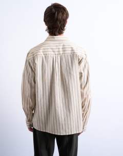 Model wearing Long sleeve relaxed stripe shirt in stone
