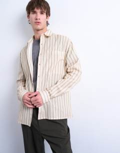 Model wearing Long sleeve relaxed stripe shirt in stone