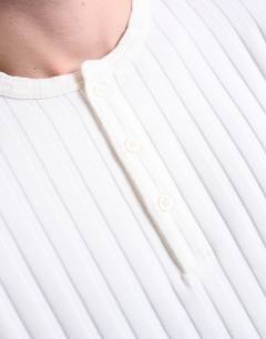 Model wearing Long sleeve rib henley tee in cream