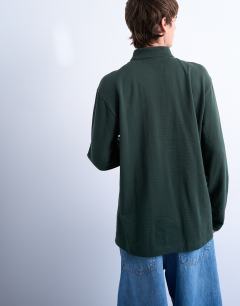 Model wearing Long sleeve textured polo in dark green