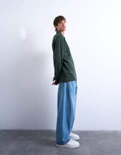 Model wearing Long sleeve textured polo in dark green