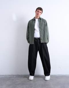 Model wearing Long sleeve washed overshirt in khaki