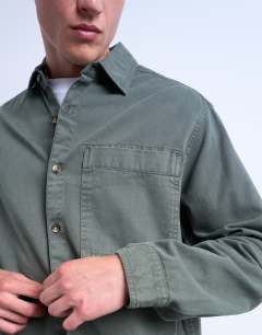 Model wearing Long sleeve washed overshirt in khaki