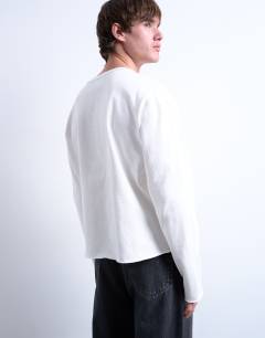 Model wearing Long sleeved heavy weight slub raw edge tee in white