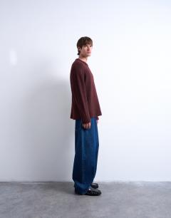 Model wearing Loose knit crew jumper in burgundy