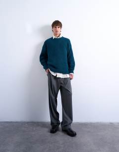 Model wearing Loose knit crew jumper in dark blue