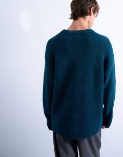 Model wearing Loose knit crew jumper in dark blue