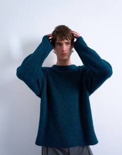 Model wearing Loose knit crew jumper in dark blue