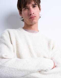 Model wearing Loose knit crew jumper in ecru