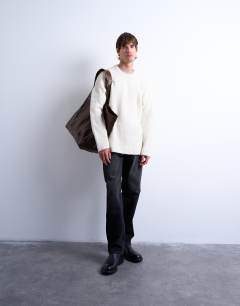 Model wearing Loose knit crew jumper in ecru