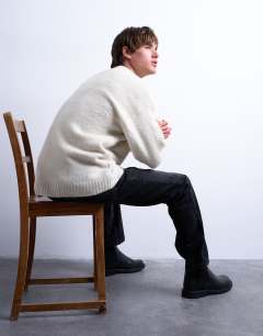 Model wearing Loose knit crew jumper in ecru