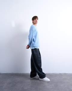 Model wearing Loose knit crew jumper in mid blue