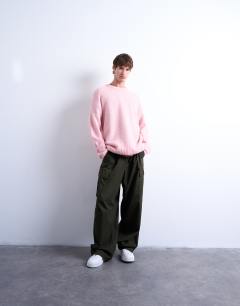 Model wearing Loose knit crew jumper in pink