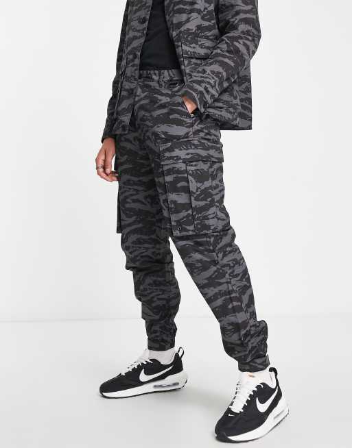 Topman loose with all over animal print cargo trousers in charcoal 