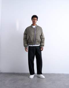 Model wearing MA1 bomber jacket in khaki