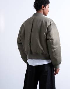 Model wearing MA1 bomber jacket in khaki