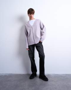 Model wearing Mixed up knitted cardigan in lilac