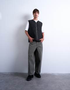 Model wearing Onion quilted gilet in black
