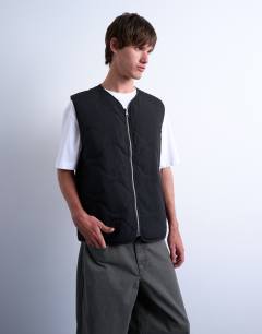 Model wearing Onion quilted gilet in black