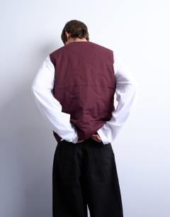 Model wearing Onion quilted gilet in burgundy