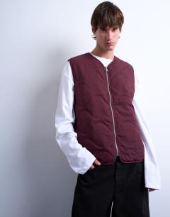 Model wearing Onion quilted gilet in burgundy