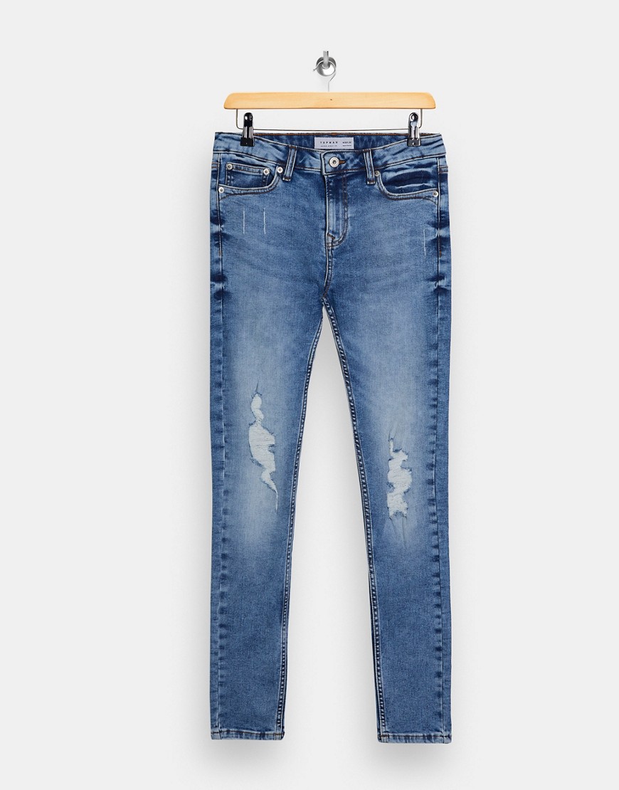 Topman organic cotton blend rip super spray on jeans in mid wash-Blues