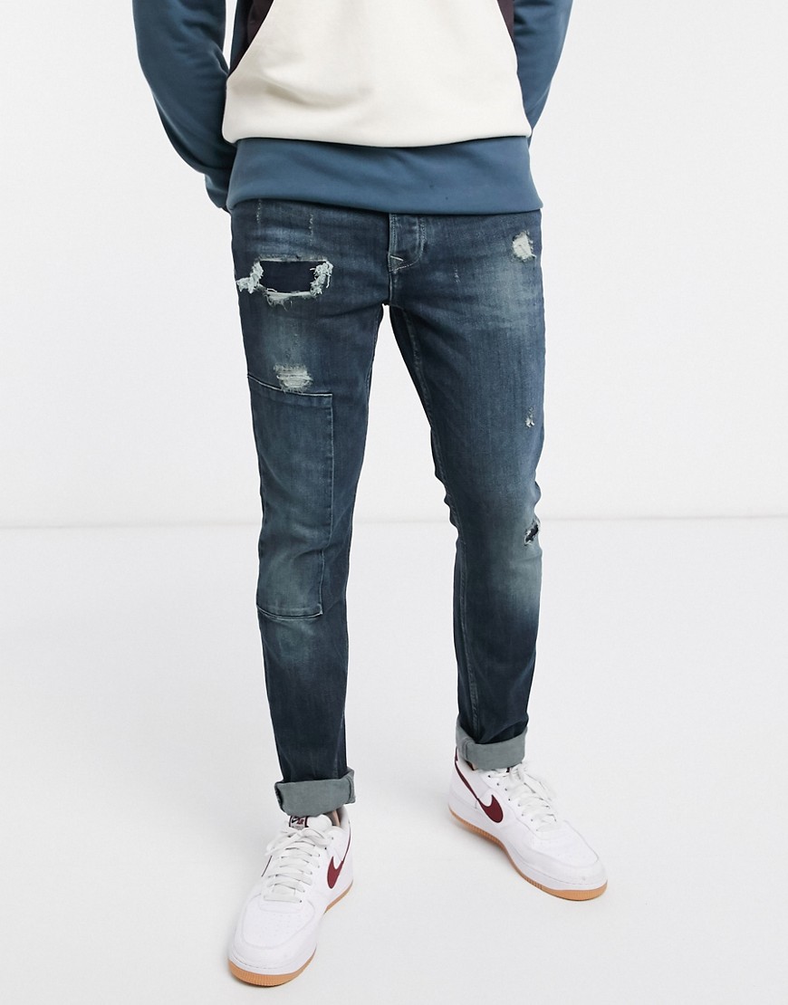 Topman organic cotton blend skinny jeans with repair patches in mid blue