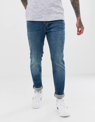 Topman organic cotton blend stretch slim jeans in mid wash blue-Blues