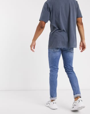 skinny jeans and polo shirt