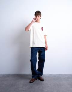 Model wearing Oversized Chateau Ermont applique t-shirt with back print in ecru