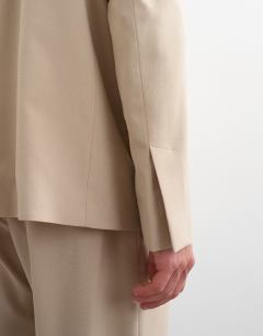 Model wearing Oversized collarless blazer in stone