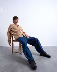 Model wearing Oversized fit button through cardigan in stone