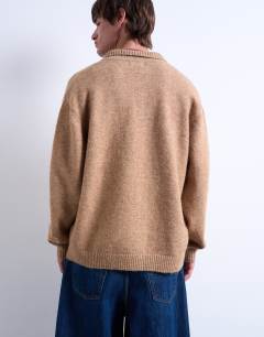 Model wearing Oversized fit button through cardigan in stone