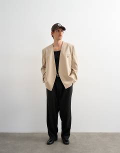 Model wearing Oversized fit collarless blazer in stone