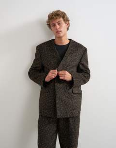 Model wearing Oversized fit collarless double breasted blazer with leopard print in brown