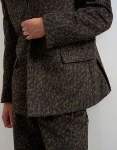 Model wearing Oversized fit collarless double breasted blazer with leopard print in brown