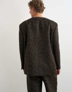 Model wearing Oversized fit collarless double breasted blazer with leopard print in brown