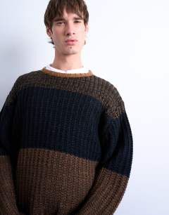 Model wearing Oversized fit colour block stripe jumper in brown